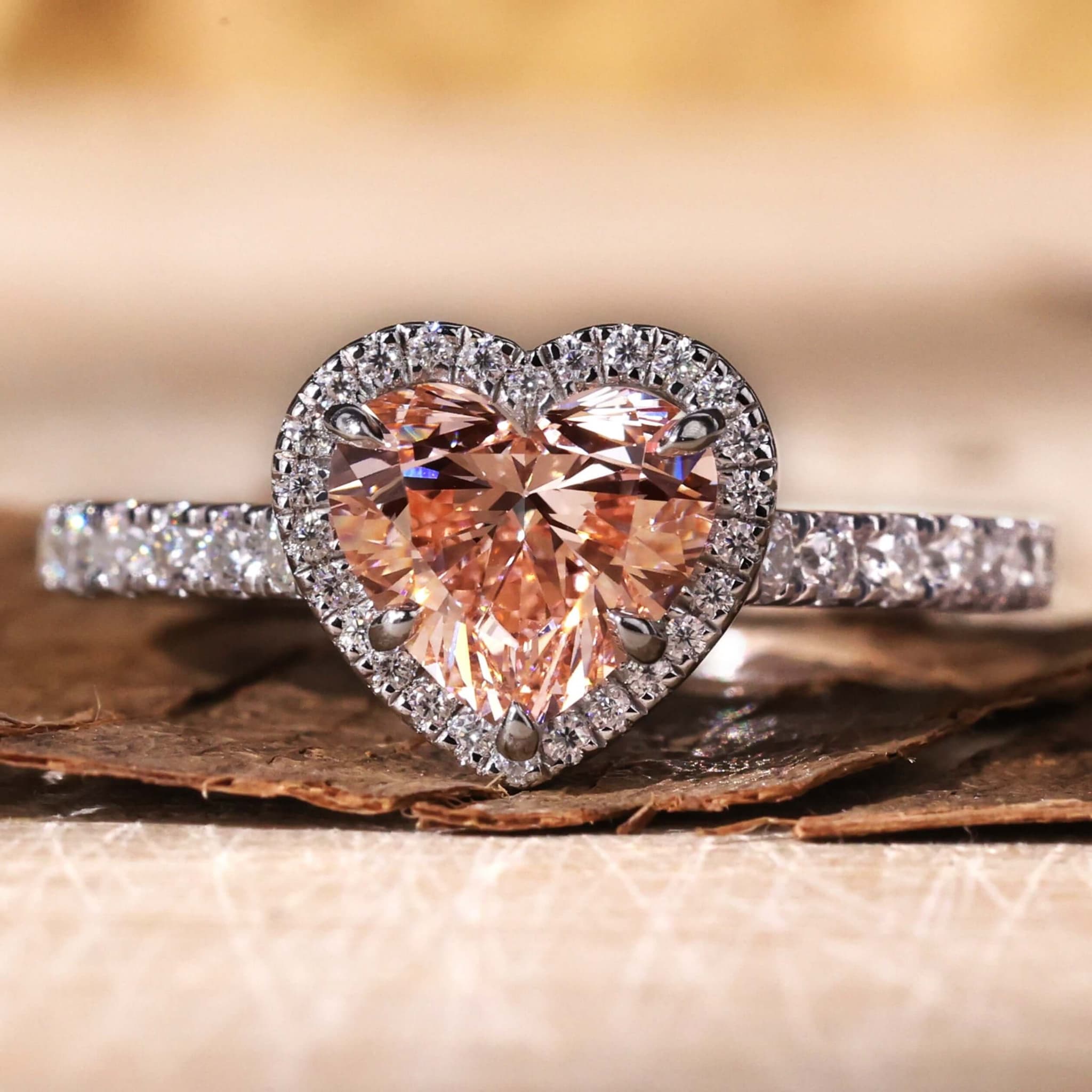 Heart-cut pink sapphire ring with micro pavé halo